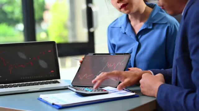 Two stock traiders making analysis of digital market and investment in block chain crypto currency. Stock trade concept