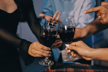 Diversity, dinner and group of people toast celebration together at party. Friends, happy and celebrate with food, wine and friendship for love, support and cheers champagne at business function