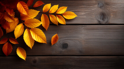 Warm autumn background with golden leaves scattered on wooden surface creating cozy seasonal atmosphere
