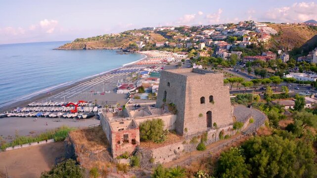 4k drone forward video (Ultra High Definition) of  historical place - Talao Tower. Wonderful morning cityscape of Scalea town, Province of Cosenza, Italy. Vacation concept background.