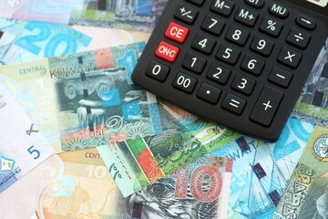 Kuwaiti dinar currency money bills and calculator close up. The concept of taxation and money count