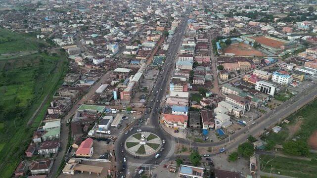 Aerial view of the Ahmadu Bello Way roundabout, with cars circling, surrounded by buildings and lush greenery creating a vibrant urban landscape, Kaduna, Kaduna, Nigeria.