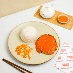 Chicken rice topped with creamy homemade sauce, torched to golden perfection. A fusion of Japanese and Indonesian flavors, perfect for food photography or restaurant menus.