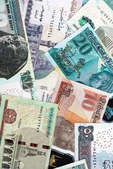 Egyptian pound currency money bills. The current banknotes lies on table in big amount close up