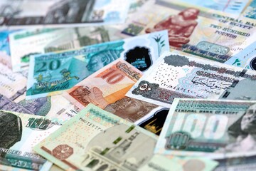 Egyptian pound currency money bills. The current banknotes lies on table in big amount close up
