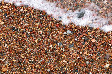 colorful pebbles on the seashore, top view