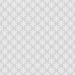 Seamless repeating snowflake pattern on gray background. Festive winter and Christmas texture ideal for wrapping paper, textiles, gift tags, holiday backgrounds, greeting cards, and seasonal designs.
