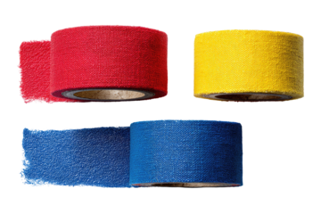 Three rolls of brightly colored fabric tape, red, yellow, and blue, arranged in a loose triangular pattern against a black background