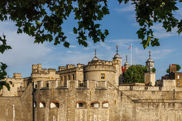 Tower of London medieval fortress with summer foliage