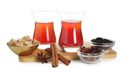 Traditional Turkish tea, dry leaves, cinnamon sticks, anise star and sugar isolated on white