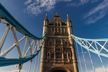 Symmetrical view of Tower Bridge tower and suspension spans