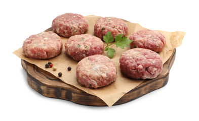 Raw meat patties with parsley and peppercorns isolated on white
