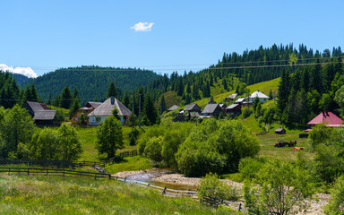 A peaceful village nestled among green hills