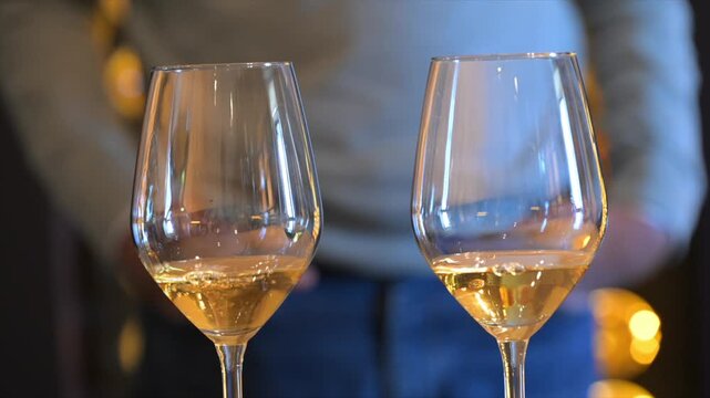 Sweet Sauternes wine served in two glasses in a cellar in the Bordeaux vineyards, High quality 4k footage