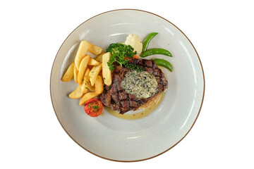 A mouthwatering steak dish with a side of fries and vegetables. The dish is presented on a white plate, showcasing a perfectly grilled steak topped with a flavorful sauce, alongside golden fries.