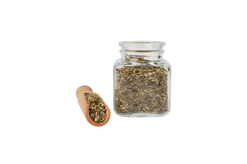 Dry Tansy Herb in latin Tanacetum vulgare in wooden scoop and glass jar isolated on white background. Herbs. Alternative medicine.