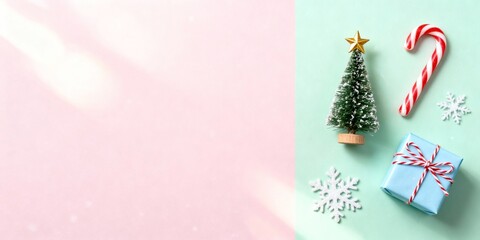 Festive pastel Christmas scene with mini tree and candy cane with copy space