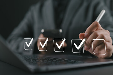Checklist concept. Businesswoman using laptop. Checking mark on checkboxes.