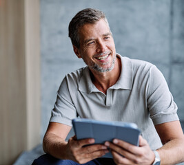 Portrait of a smart young businessman using a tablet computer in the office or classroom. Startup and succesful business concept or education and student concept