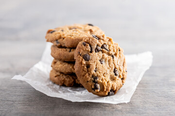 Baked chocolate chip cookies on wooden table