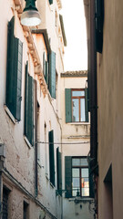 Venetian cityscape with close buildings and romantic old architecture