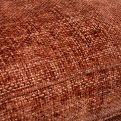 Detailed close-up of terracotta chenille sofa upholstery highlighting fabric weave, warm earth tones, and soft texture. Perfect for interior design, textile, or furniture craftsmanship concepts