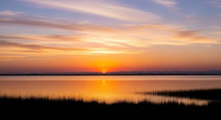 Serene sunset over calm lake with vibrant sky for nature and travel inspiration