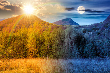 mountain landscape with forest on autumn equinox. day and night time change concept. nature park with birch trees in colorful foliage with sun and moon at twilight. horizontal astrology background