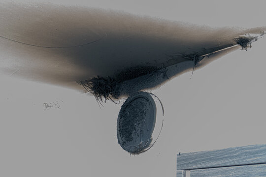 Burnt out LED lamp. A lampshade lamp on the wall after a fire. Spontaneous combustion and fire in a residential building. Indoor