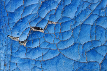 blue texture of old leather upholstery in the cracks with a torn hole in the lining