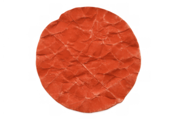 Crumpled orange circle paper texture creating an abstract background with wrinkled surface, transparent background