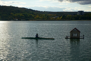 A lone kayaker on a lake