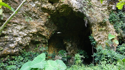 “Rock Cave with Light at the Entrance