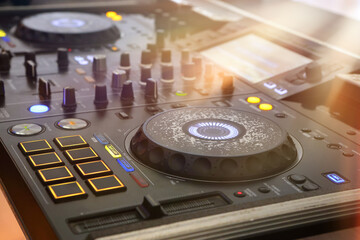 DJ table mixer closeup in the empty nightclub before the party