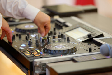 DJ table mixer closeup in the empty nightclub before the party