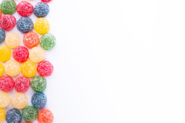 frame of colorful jelly beans in different flavors with copy space 