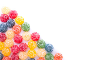 diagonal of colorful jelly beans in different flavors with copy space 