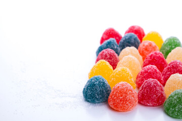 A pile of sugary jelly beans in different colors and flavors. Unhealthy junk food.