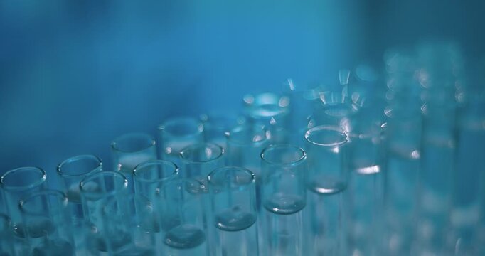 Test tube, science and pipette at lab with liquid, chemical and process for pharmaceutical solution. Container, medical research and study with tools, closeup and virus dna for vaccine development