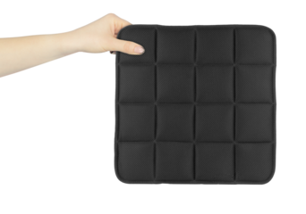 chair cushion in hand, outstretched hand with chair cushion isolated on background