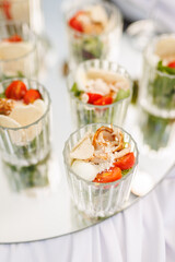 Individual salad appetizers served in glasses
