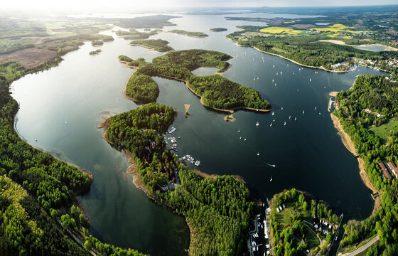 Fototapeta Expansive aerial view of lakes and forested land, A bird s eye view of a lake landscape