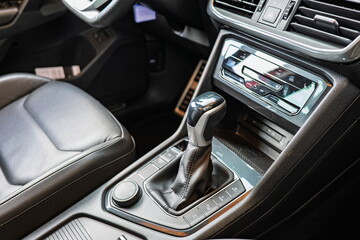 New car interior dashboard with automatic gearbox lever. Top down, wide angle view, no people