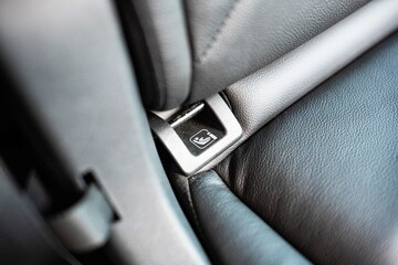 New car child isofix seat anchor point pictogram. Close up shot, back seat bench, no people