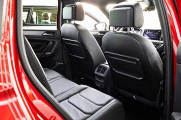 New car empty leather back seats. Close up, wide angle view, no people