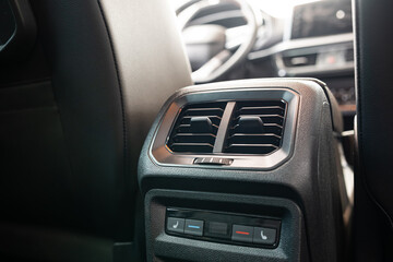 New car rear seats air vents for the rear passengers. Close up, wide angle shot, no people