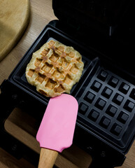 cooking homemade waffles