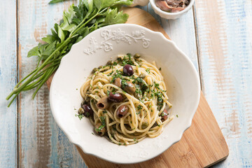 spaghetti with anchovy capers  black olives and parsley