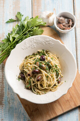 spaghetti with anchovy capers  black olives and parsley