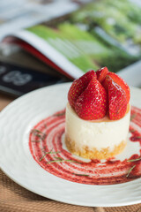 A delicious strawberry cheesecake elegantly presented on a plate